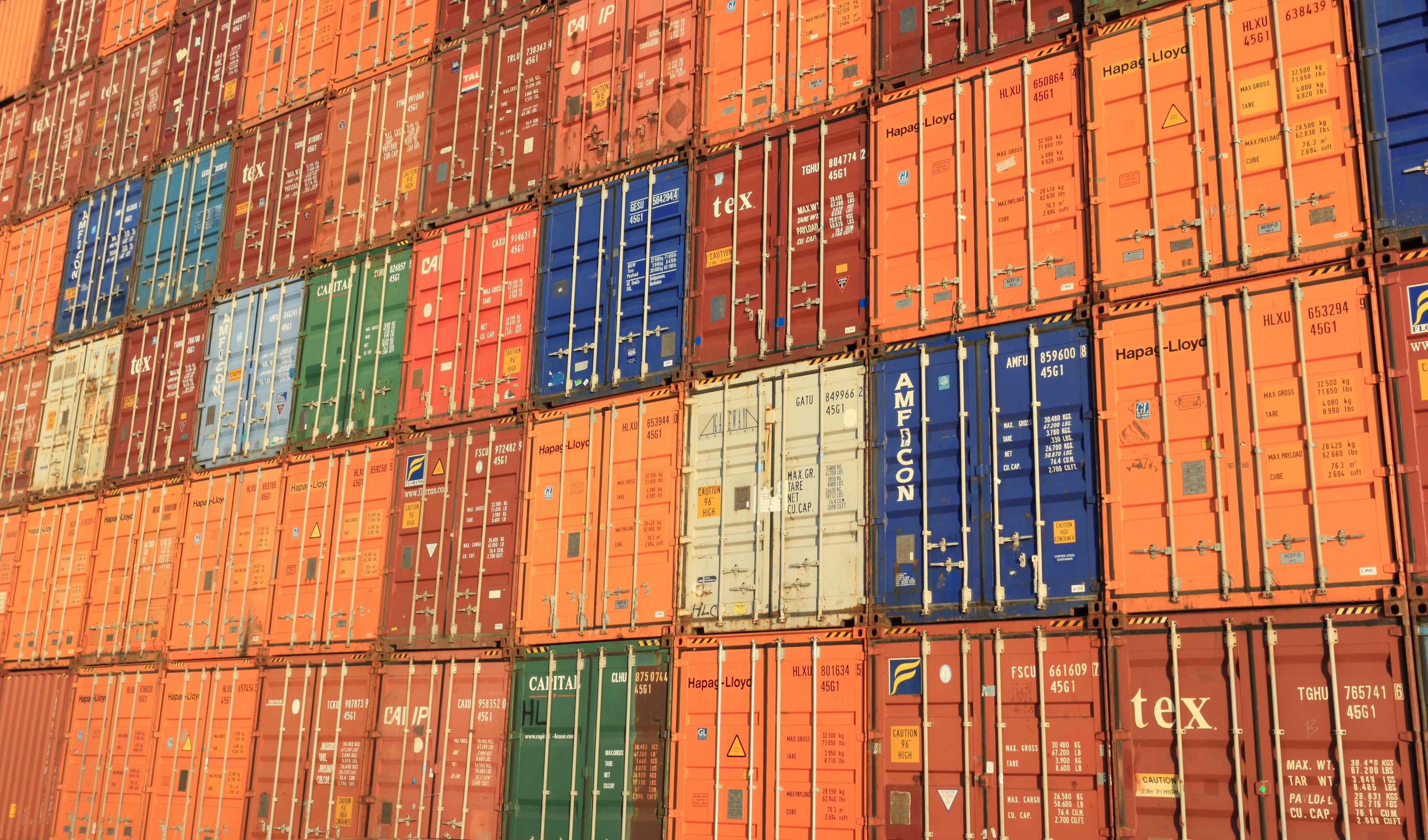 Wall of orange shipping containers