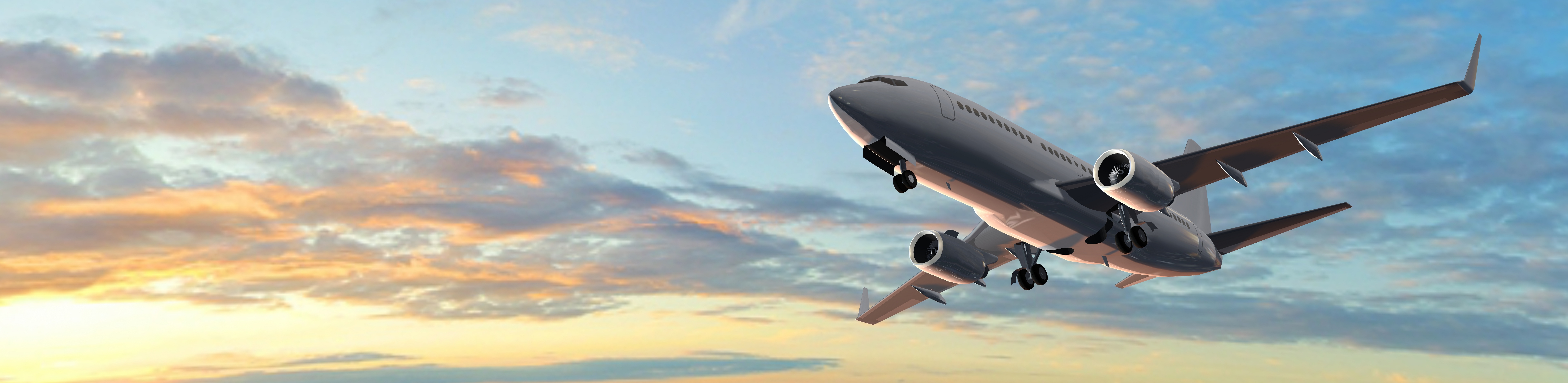 image of a civil aircraft flying by a cloud bank tinted orange