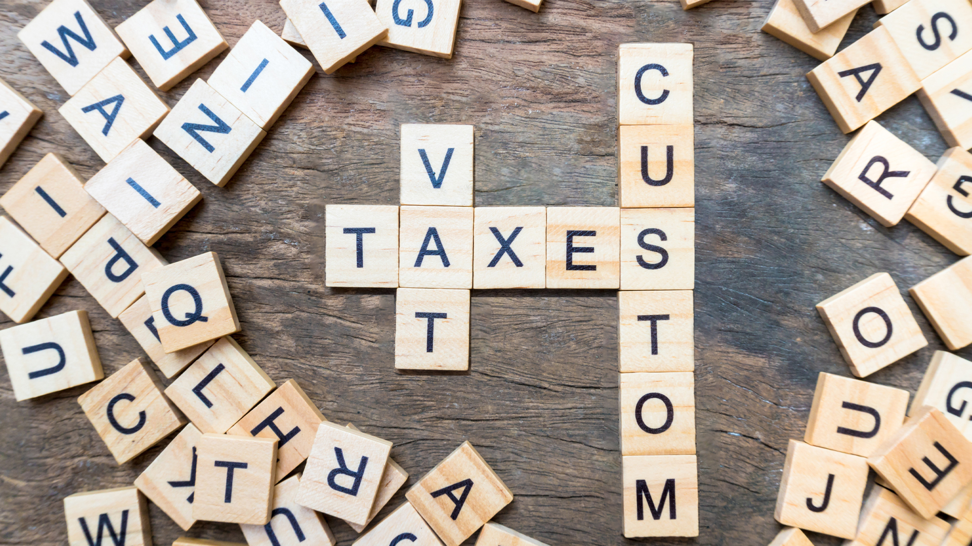 Taxes print text on wood square blocks Image