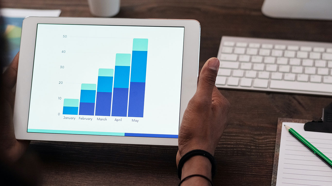 person looking at chart on tablet